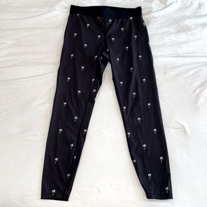 Alala Active Tights in black with palm tree print